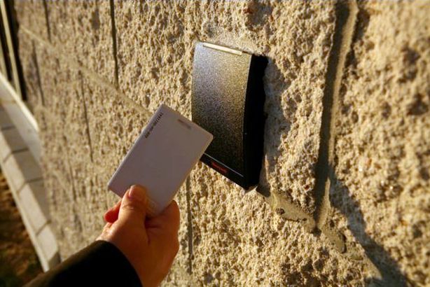 A card and card reader in use on an outside wall