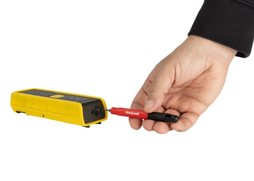 Hand with Honeywell Handheld Pump