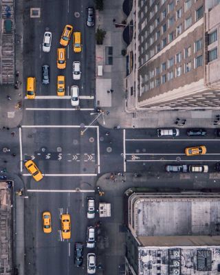 An aerial view of NYC streets with yellow cabs.