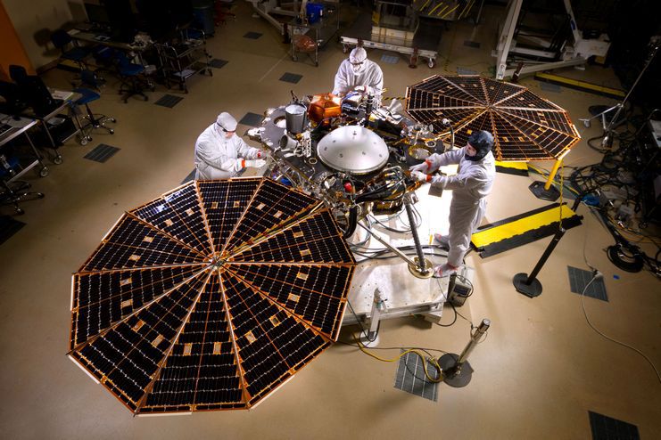 NASA's InSight Mars lander spacecraft in a Lockheed Martin clean room near Denver. As part of a series of deployment tests, the spacecraft was commanded to deploy its solar arrays in the clean room to test and verify the exact process that it will use on the surface of Mars.