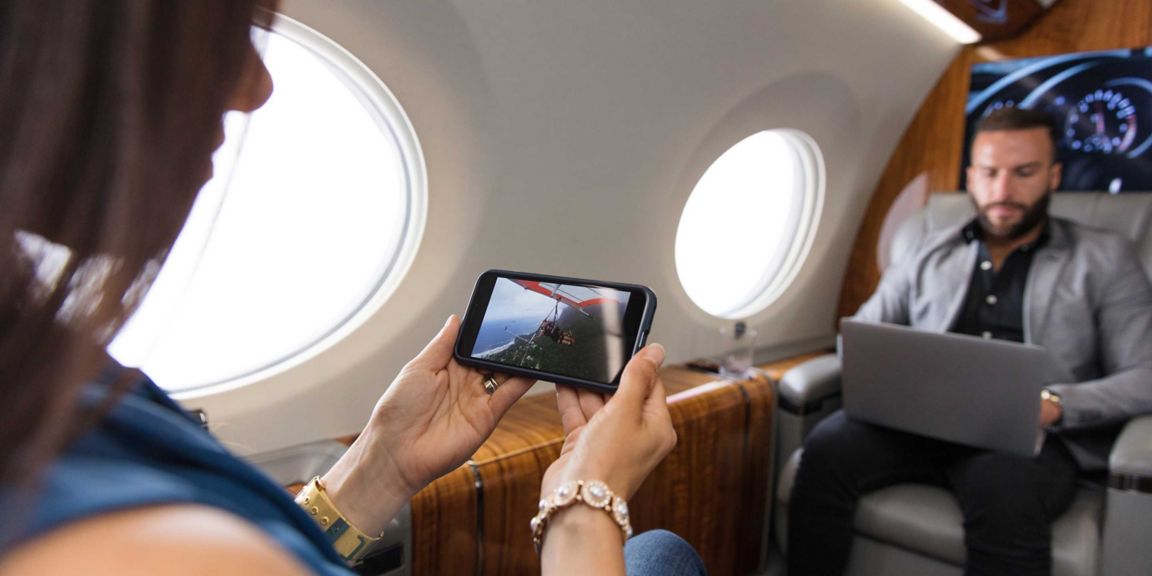 Passenger using iPhone in Cabin
