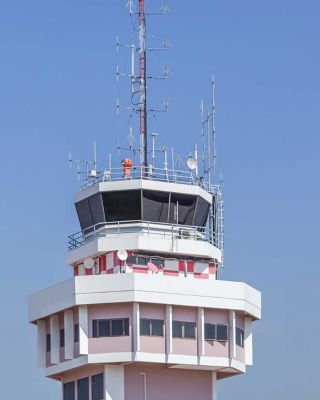 Plane over control tower