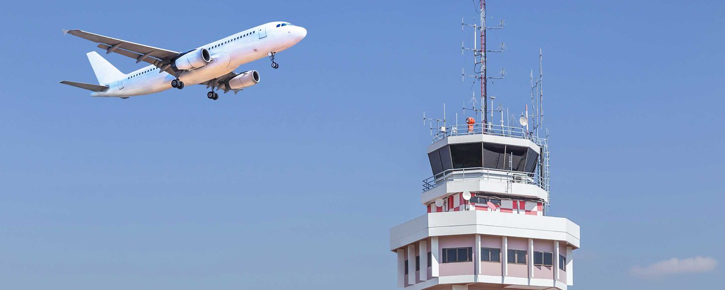 Plane over control tower