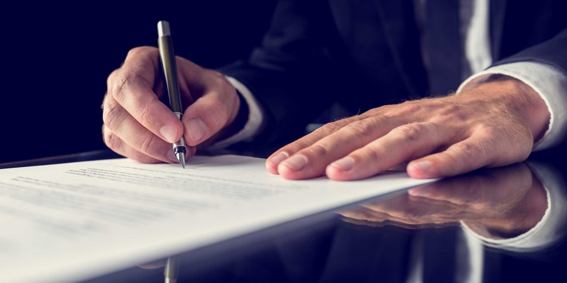 Business Man signing paper