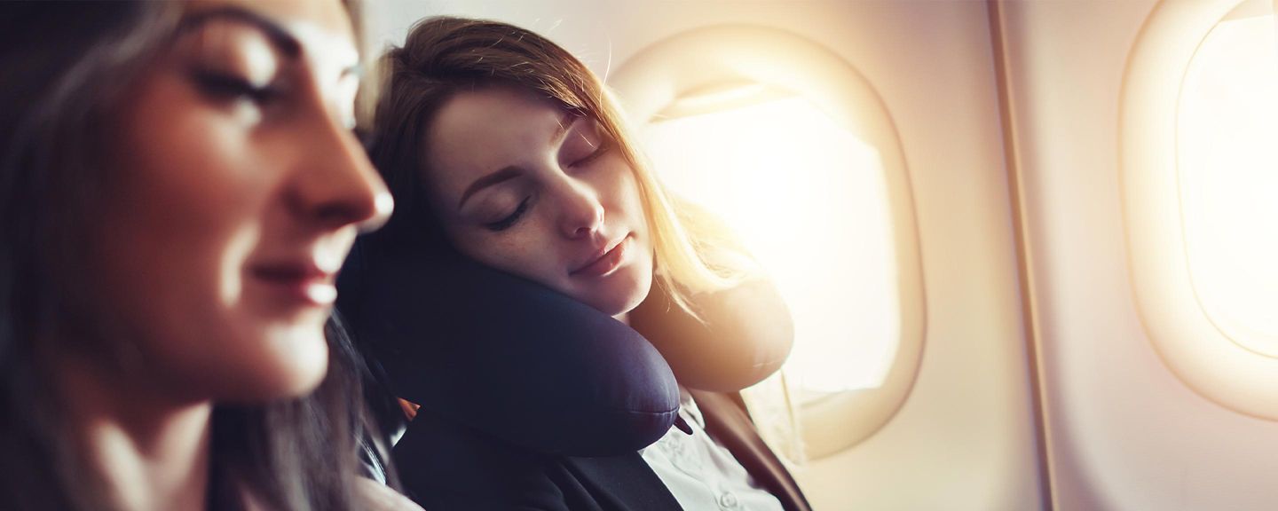 Lady sleeping in an airplane