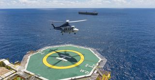 Helicopter landing at helipad