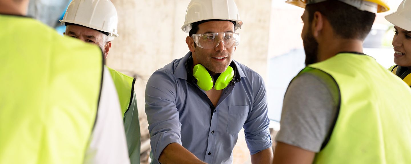 Guys in hardhats shaking hands