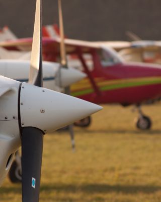Row of planes' propellers at autumn sunset