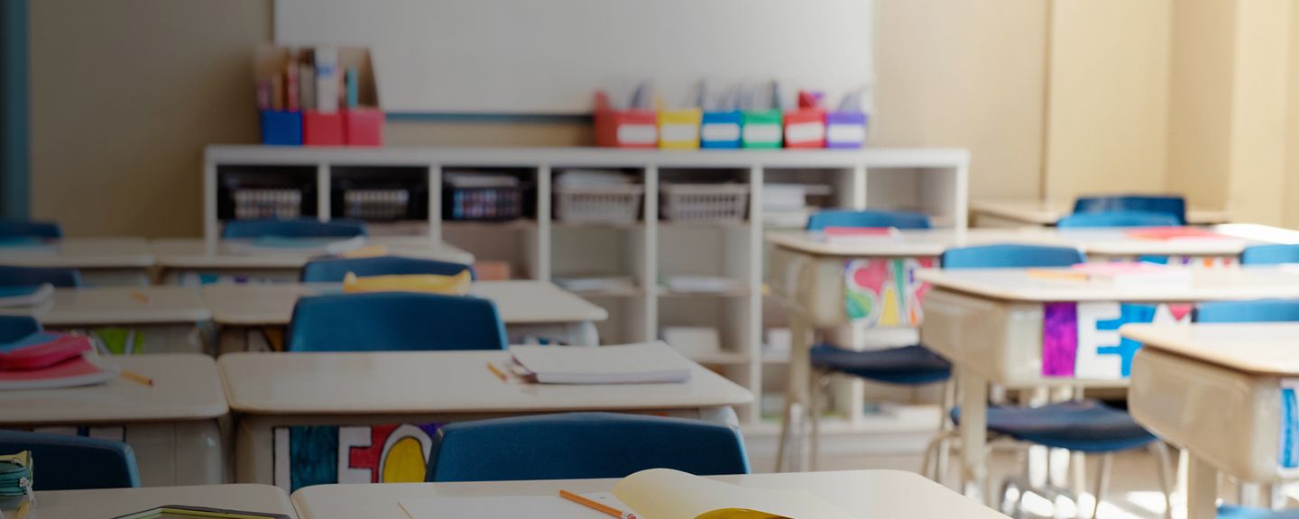 Classroom without children at school's out. The desks are in rows and you can read the names of the children on the front of the desks drawn in multicolour. Photo was taken in elementary school in Quebec Canada.