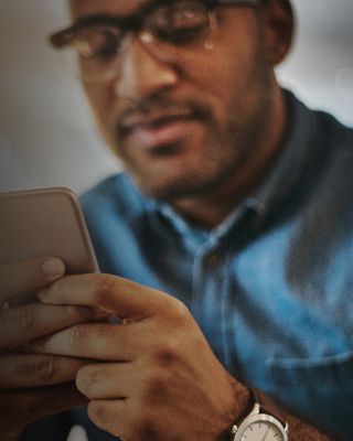 Man using handheld device