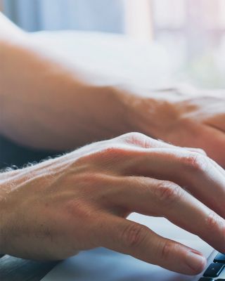 Person typing on laptop