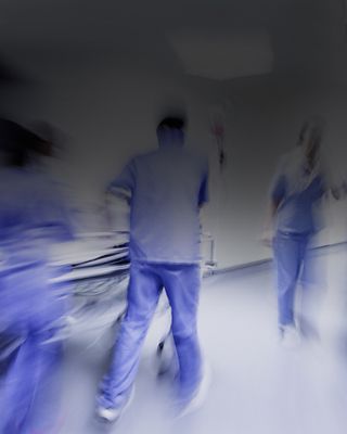 People walking in and out of the hospital - Healthcare concepts