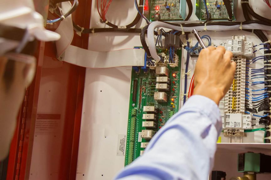 Person servicing fire detection equipment