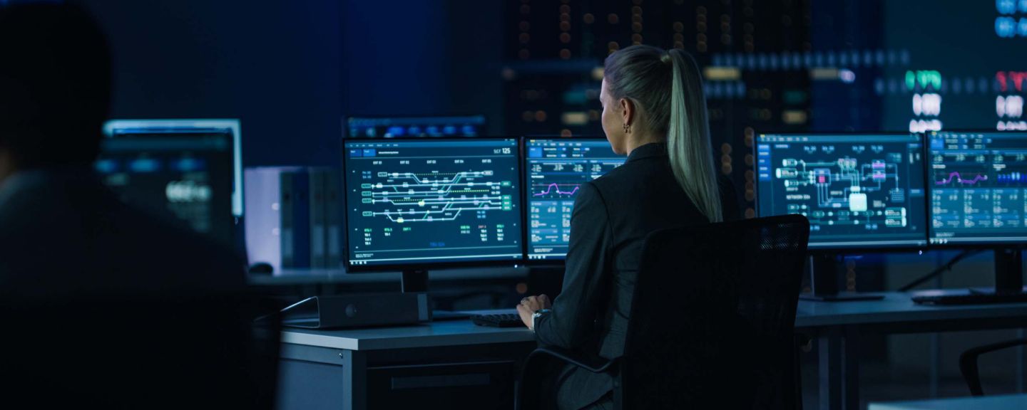 Computer Science Female Engineer Working under Important Project on Personal Computer Showing Infrastructure Infographics and Data.Telecommunications Control Monitoring Room with People Working.