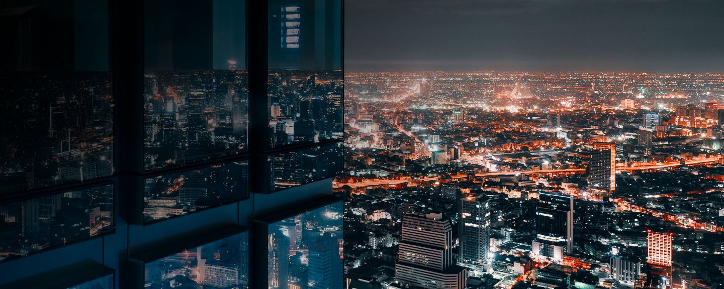 Lit up buildings at night in a city