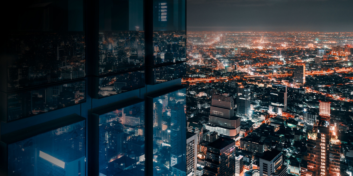 Lit up buildings at night in a city