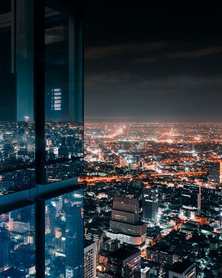 Lit up buildings at night in a city