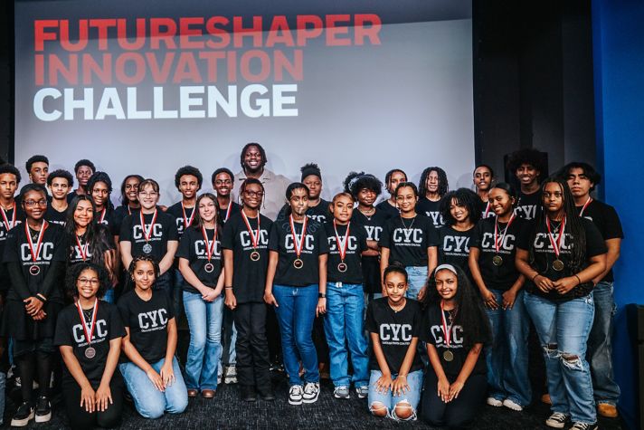 A group of students who participated in the 2024 Futureshaper Innovation Challenge pose in a group photo.