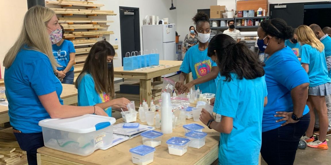 Teachers working with students on STEM activities