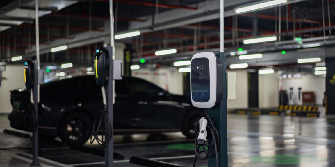Electric vehicle charging stations inside of a parking garage