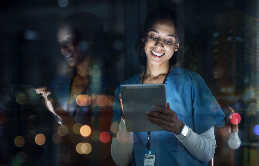 Medical, research and night with doctor and tablet for planning, medicine and schedule. Technology, review and digital with black woman reading report for healthcare, science and life insurance news.