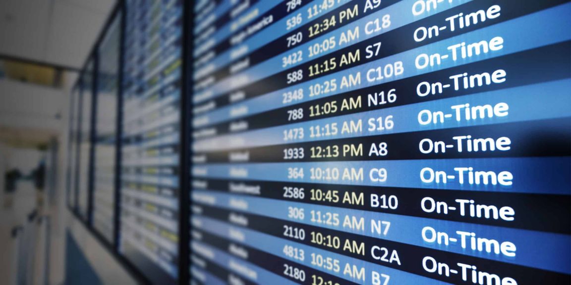 an image of a digital flight information display at an airport featuring real-time updates on flights