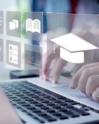 a conceptual representation of digital education or e-learning. It shows a person using a laptop with an overlay of educational icons, including a graduation cap, a lightbulb, and books.