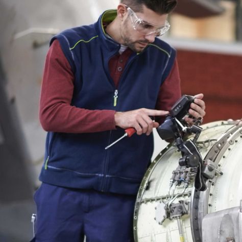 Engineer giving maintenance to an engine