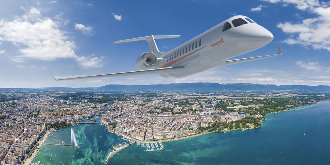 Honeywell jet in flight over a city, with skyscrapers and a vibrant urban landscape visible below