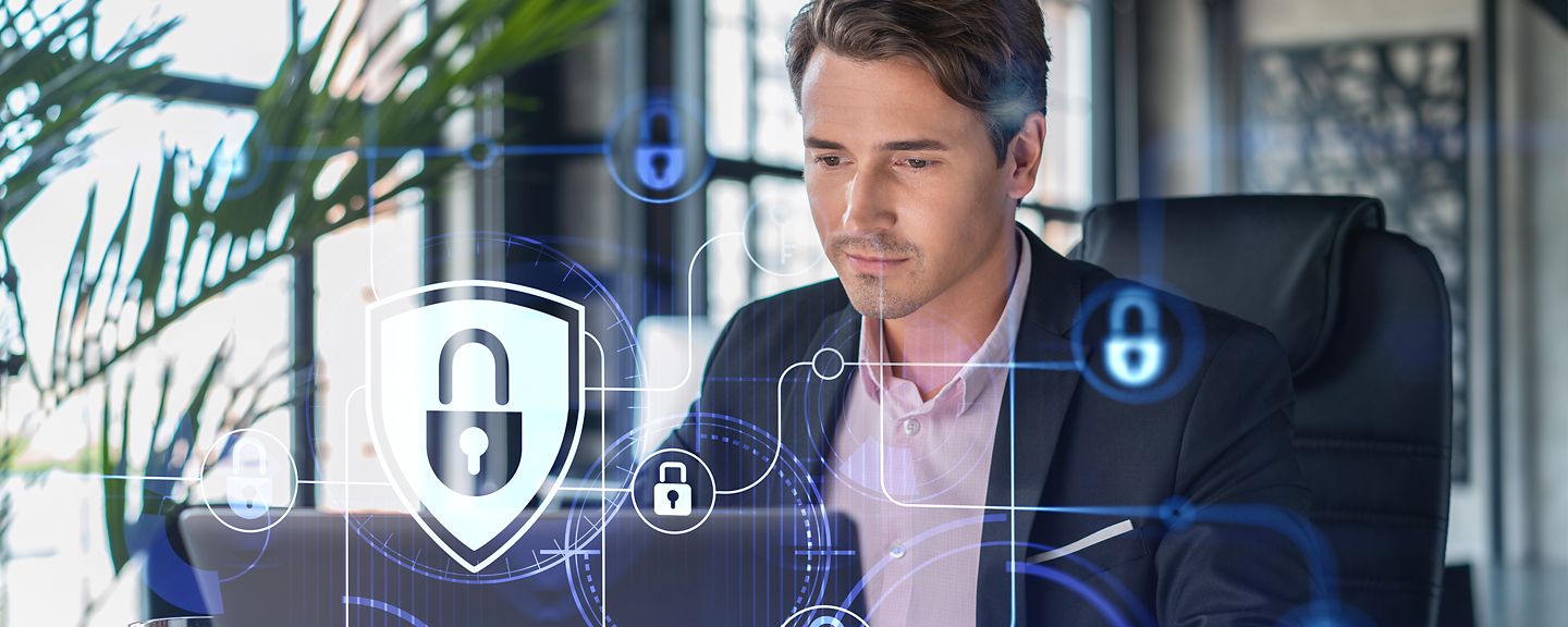 Man sitting in front of laptop for cyber security