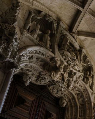 Intricate carvings and arches under a beautifully vaulted ceiling.