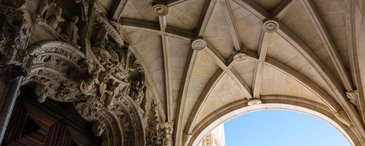 Intricate carvings and arches under a beautifully vaulted ceiling.