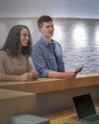 Onity couple checking in to hotel