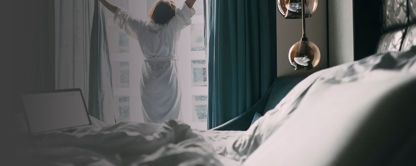 hon-ba-onity-woman-stretching-hotel-room-2880x1440.jpg
