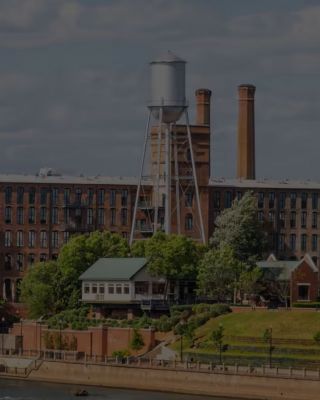 Supra industrial city skyline next to water