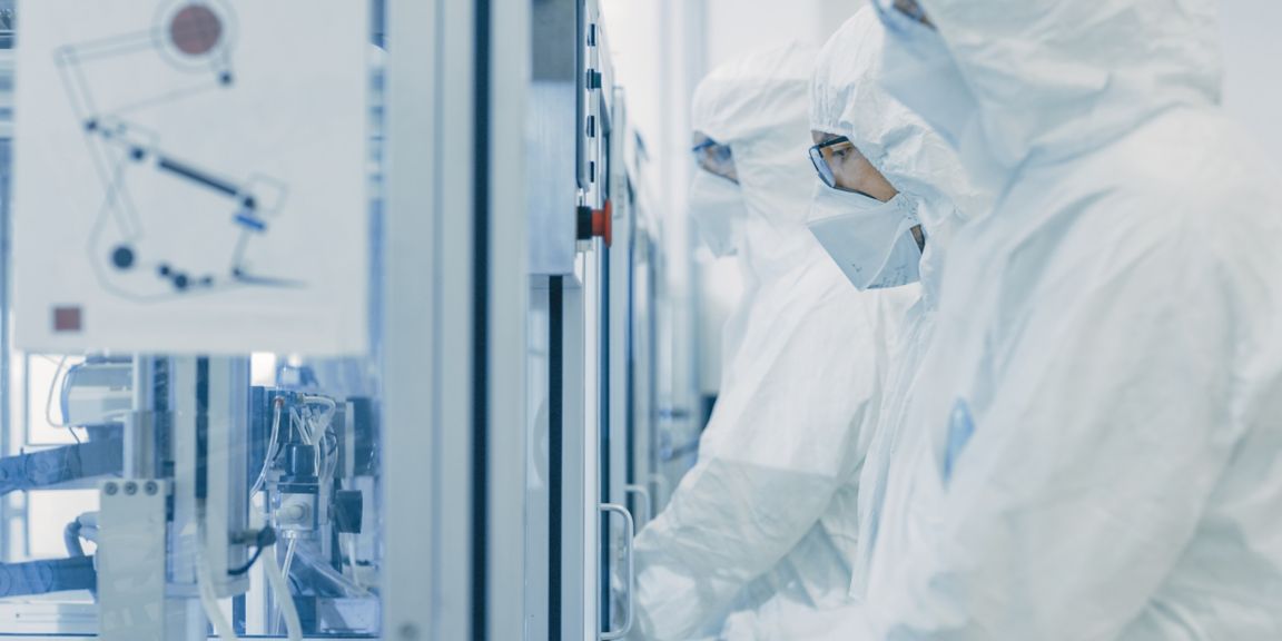 On a Factory Team of Scientists in Sterile Protective Clothing Work on a Modern Industrial 3D Printing Machinery. Pharmaceutical, Biotechnological and Semiconductor Creating / Manufacturing Process