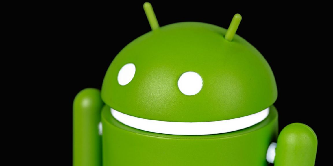 A close-up image of the green Android robot figure, featuring its iconic antennae, white circular eyes, and a white line mouth, set against a solid black background. Ideal for content related to Android development, mobile technology, or branding.