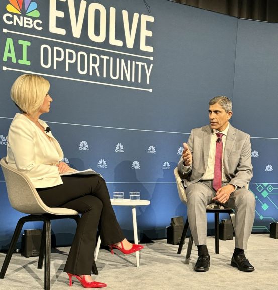 Vimal Kapur talking with CNBC host