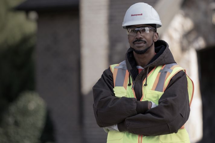 Certified field professional in safety gear supporting reliable energy infrastructure, ensuring operational excellence in gas and utility services.