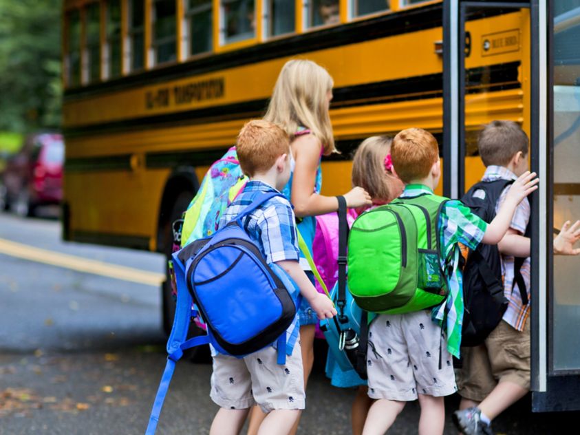 Children Boarding Yellow School Bus in Morning Routine