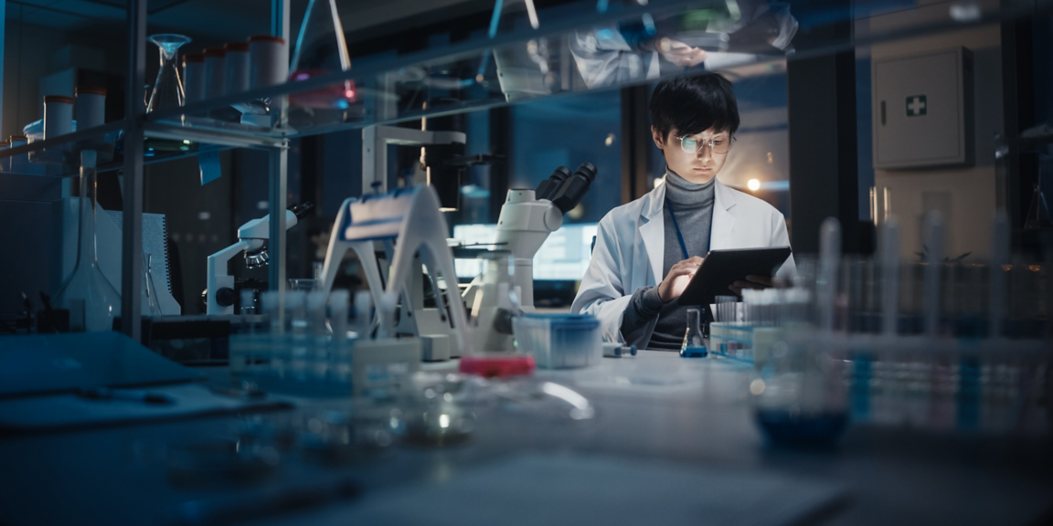 Research professional holding device in a low lit laboratory
