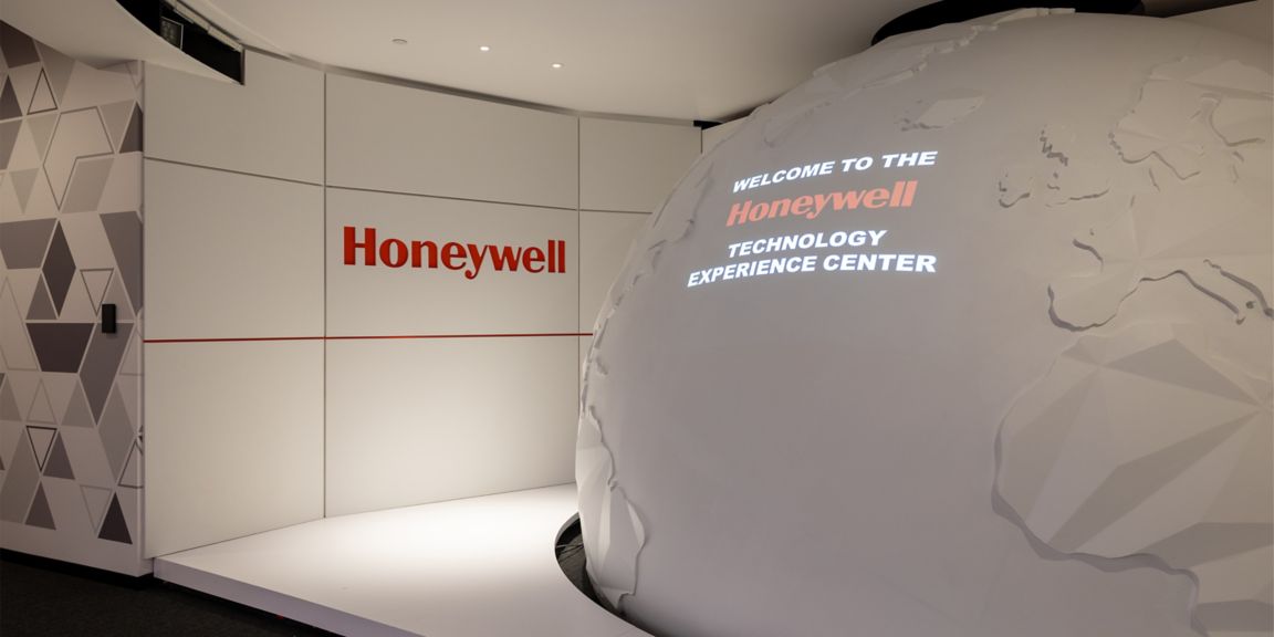 Welcome zone at Honeywell Technology Experience Center featuring global innovation themes, visual storytelling, and advanced industrial solutions presentation.