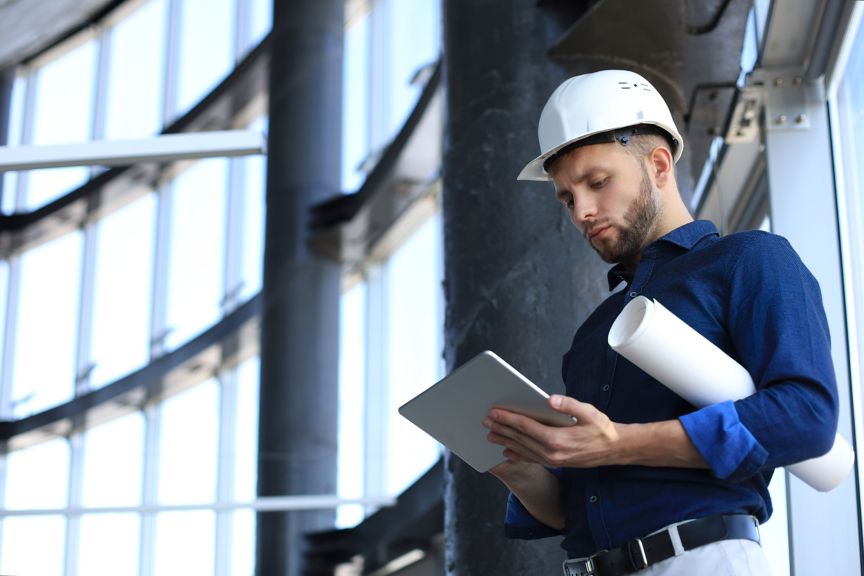 Shot of a engineer using a digital tablet evaluating every risks available on the construction site