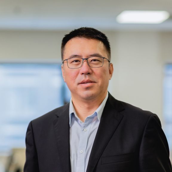 Professional portrait of Alex Cui, captured in a clean studio setting for corporate bios and leadership profiles.