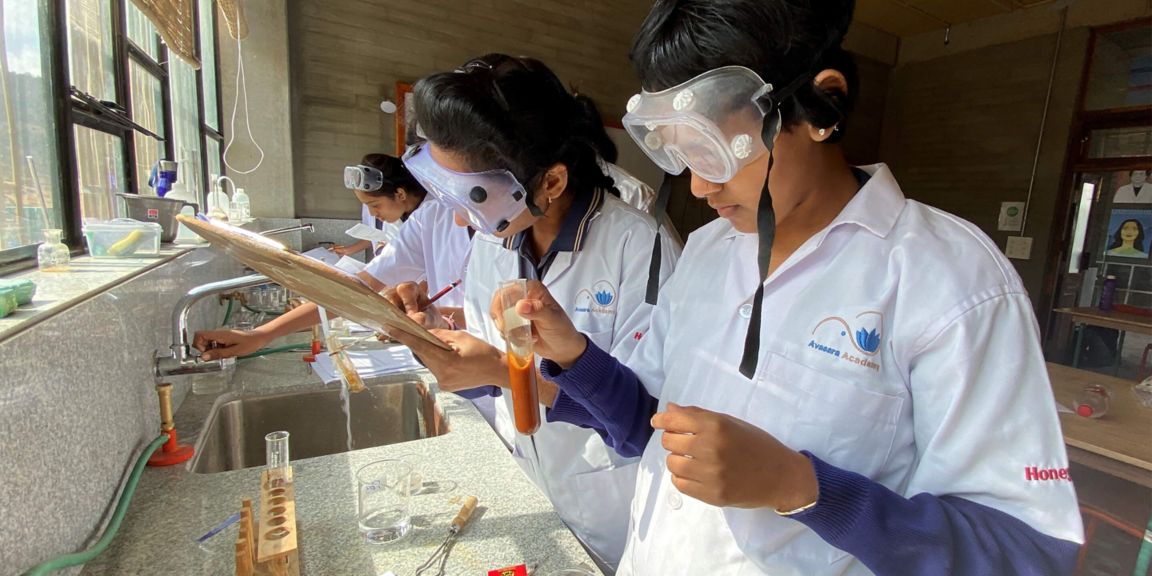 Students Performing Hands-On Science Experiments in Laboratory