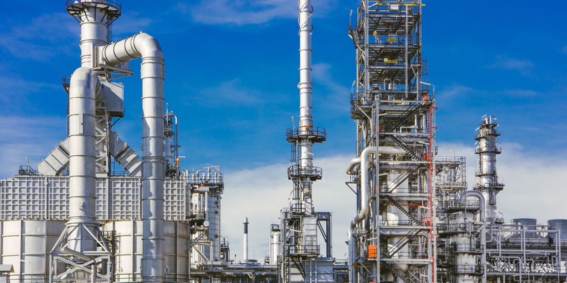 Detail of oil pipeline with valves in large oil refinery.
