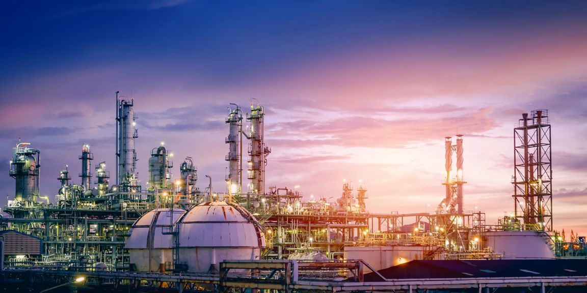 Oil and gas refinery plant or petrochemical industry on sky sunset background, Factory with evening, Manufacturing of petrochemical industrial