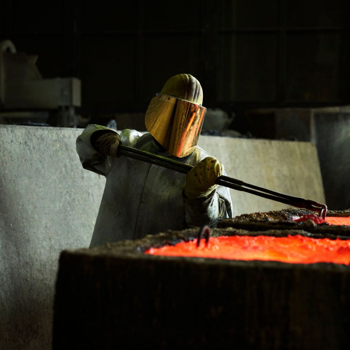 foundry worker molten metal furnace