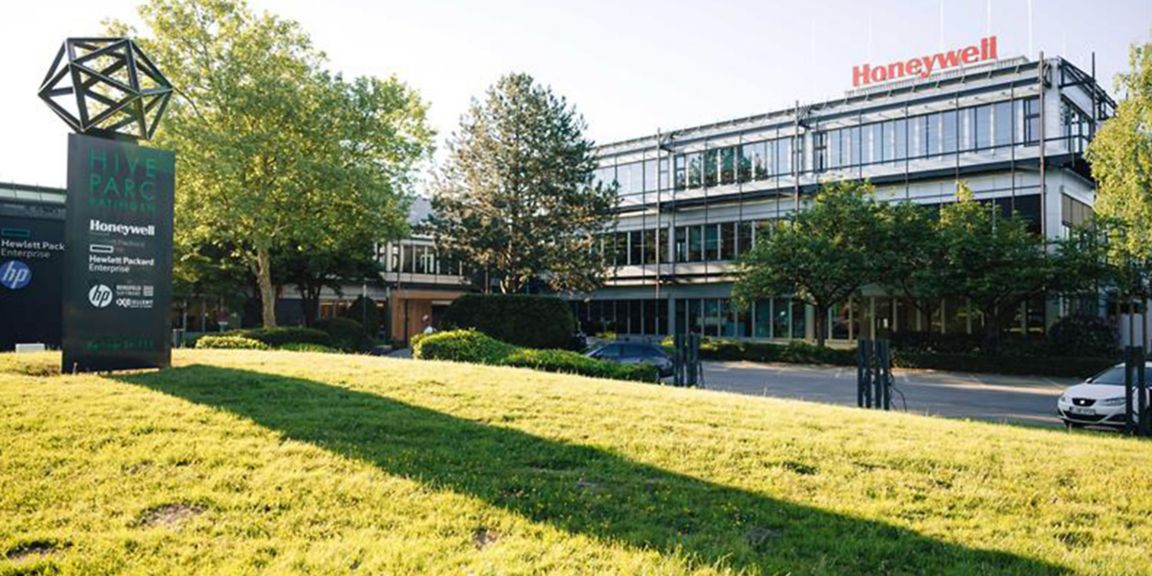 Explore a modern Honeywell office campus set in a green business park, featuring contemporary architecture, landscaped grounds, and a professional workspace.