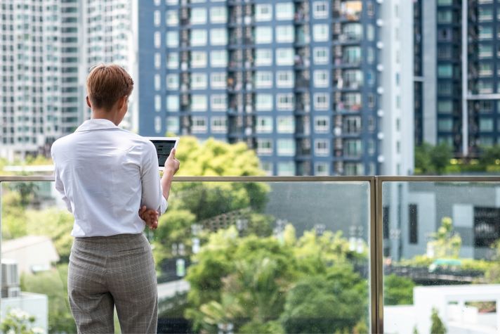 Unrecognizable business woman using tablet in business district stock photo